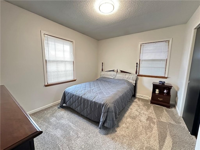 12913 E 41st St S, Independence, MO 64055 - carpeted bedroom with a textured ceiling and baseboards