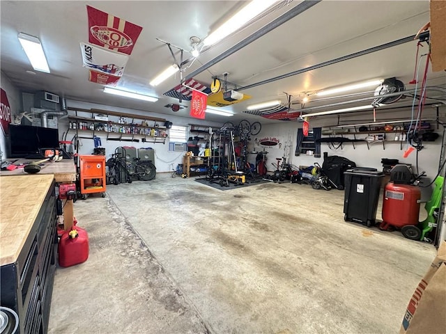 12913 E 41st St S, Independence, MO 64055 - garage featuring a workshop area and a garage door opener