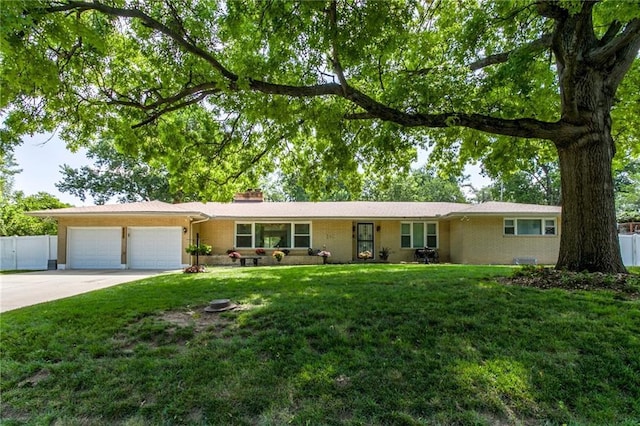 815 N 63rd St, Kansas City, KS 66102 - single story home featuring an attached garage, a chimney, and concrete driveway