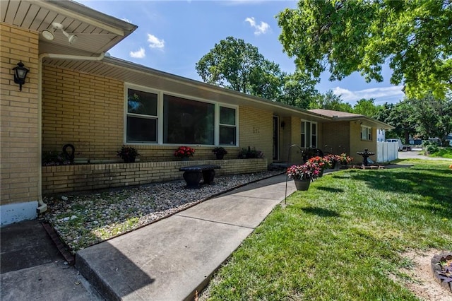 815 N 63rd St, Kansas City, KS 66102 - single story home with brick siding and a front yard