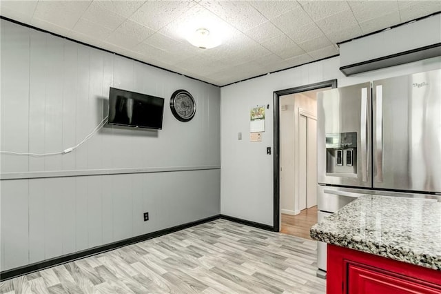 815 N 63rd St, Kansas City, KS 66102 - kitchen with stainless steel fridge and light wood-style flooring
