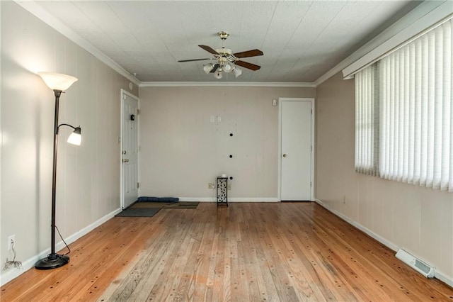 815 N 63rd St, Kansas City, KS 66102 - empty room with a ceiling fan, crown molding, and wood-type flooring