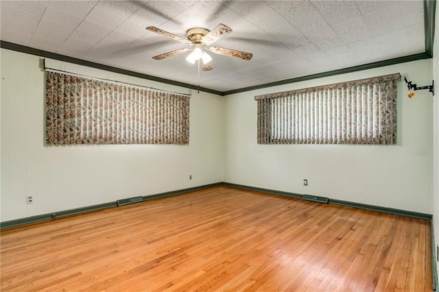 815 N 63rd St, Kansas City, KS 66102 - unfurnished room with a ceiling fan, wood-type flooring, and ornamental molding