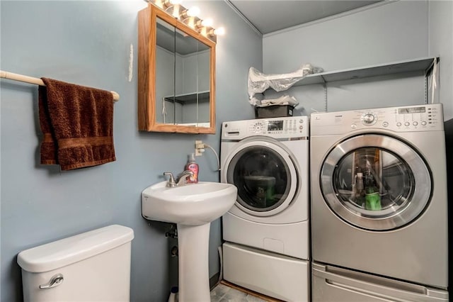 815 N 63rd St, Kansas City, KS 66102 - laundry room featuring independent washer and dryer and crown molding
