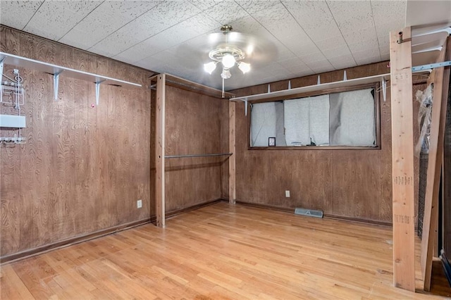 815 N 63rd St, Kansas City, KS 66102 - unfurnished bedroom featuring wood finished floors and wood walls
