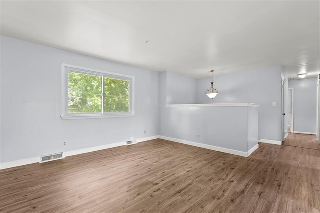 1301 Quincy St, Leavenworth, KS 66048 - empty room featuring wood finished floors and baseboards