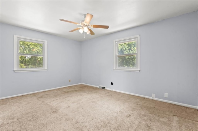 1301 Quincy St, Leavenworth, KS 66048 - empty room featuring carpet flooring and a ceiling fan