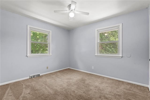 1301 Quincy St, Leavenworth, KS 66048 - carpeted empty room with ceiling fan and baseboards