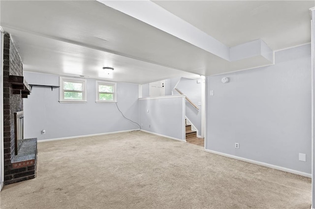 1301 Quincy St, Leavenworth, KS 66048 - below grade area featuring carpet floors, stairway, and a fireplace