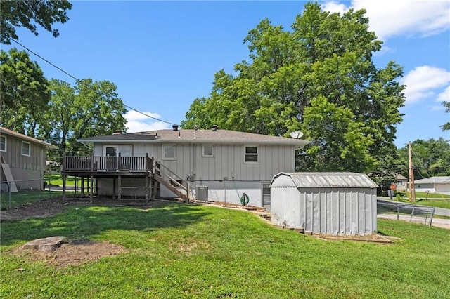 1301 Quincy St, Leavenworth, KS 66048 - rear view of house featuring stairs, a storage unit, a deck, and board and batten siding