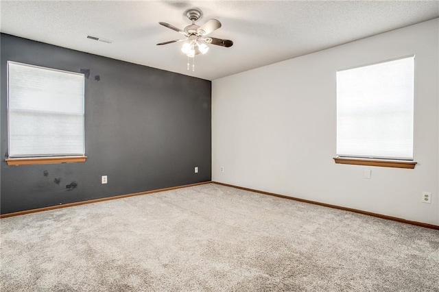 512 NE Brookwood Cir Unit A, Blue Springs, MO 64014 - carpeted empty room featuring a ceiling fan and a textured ceiling
