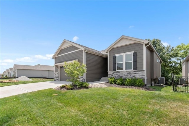1161 SW Whitby Dr, Lees Summit, MO 64083 - view of front of home featuring an attached garage, driveway, and stone siding