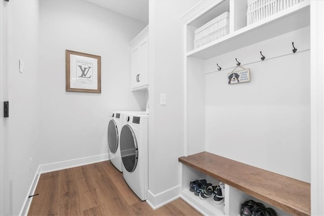 1161 SW Whitby Dr, Lees Summit, MO 64083 - laundry area with independent washer and dryer, dark wood-type flooring, and cabinet space