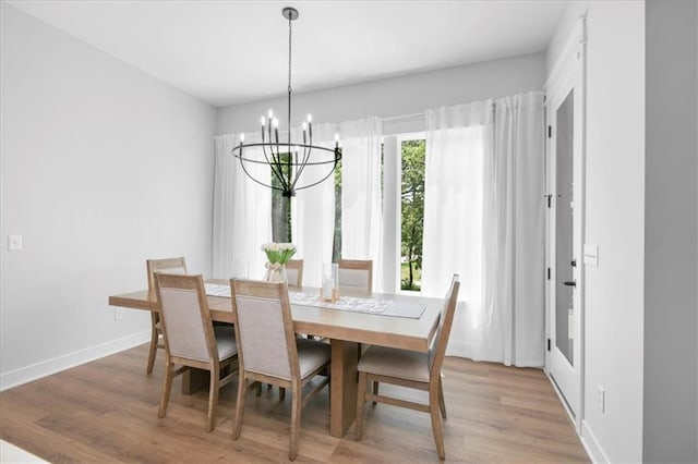 1161 SW Whitby Dr, Lees Summit, MO 64083 - dining area with light wood-style floors and a chandelier