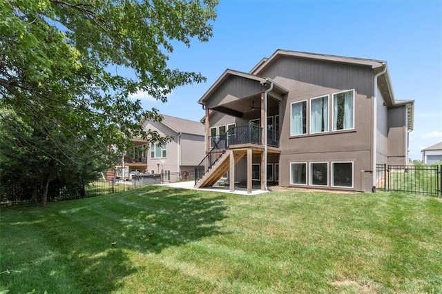 1161 SW Whitby Dr, Lees Summit, MO 64083 - back of property featuring ceiling fan, stairway, a fenced backyard, and a deck