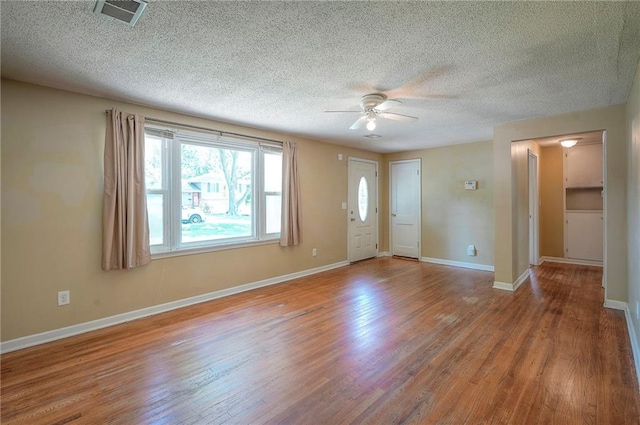 7028 Walmer St, Overland Park, KS 66204 - entryway featuring ceiling fan, wood finished floors, and a textured ceiling
