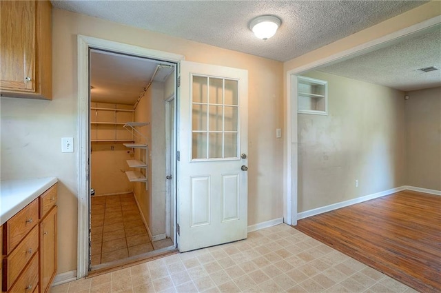 7028 Walmer St, Overland Park, KS 66204 - entryway featuring a textured ceiling