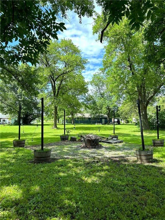 108 W Main St, Arma, KS 66712 - view of property's community featuring a yard