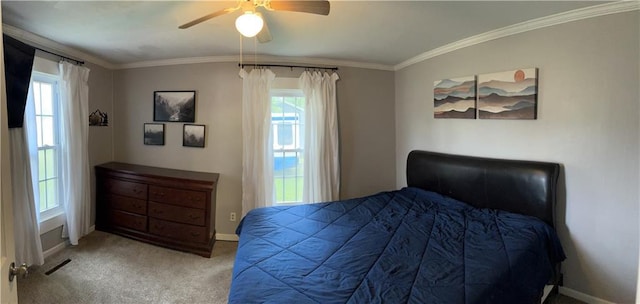 108 W Main St, Arma, KS 66712 - bedroom featuring multiple windows, crown molding, carpet flooring, and ceiling fan