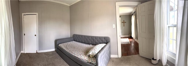 108 W Main St, Arma, KS 66712 - sitting room with arched walkways, crown molding, and carpet