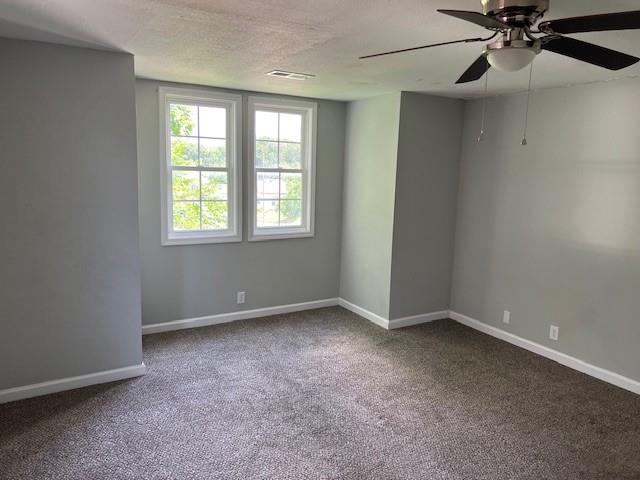 1120 S 20th St, Saint Joseph, MO 64507 - carpeted empty room featuring a ceiling fan and baseboards