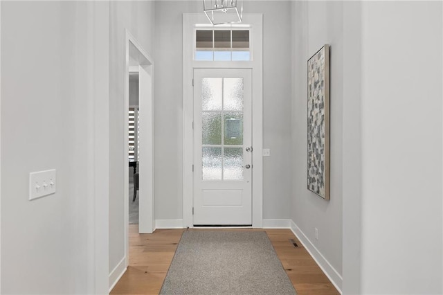 8164 Roundtree St, Lenexa, KS 66220 - doorway to outside featuring wood finished floors