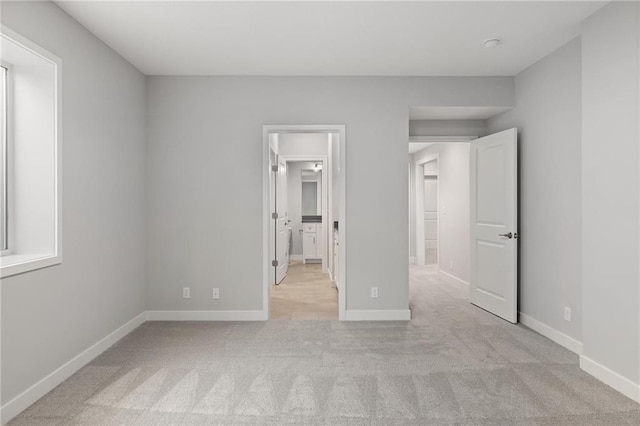 8164 Roundtree St, Lenexa, KS 66220 - unfurnished bedroom with light carpet and baseboards