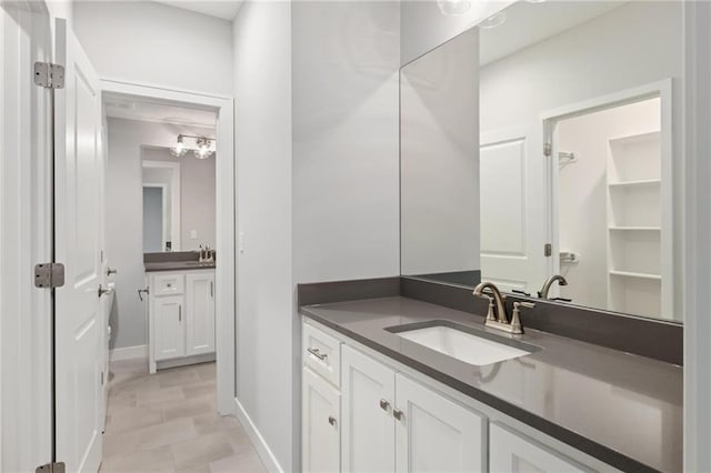 8164 Roundtree St, Lenexa, KS 66220 - bathroom with vanity and baseboards