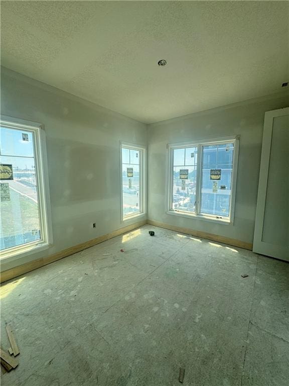 2104 W 86th Way, Leawood, KS 66206 - unfurnished room with a textured ceiling