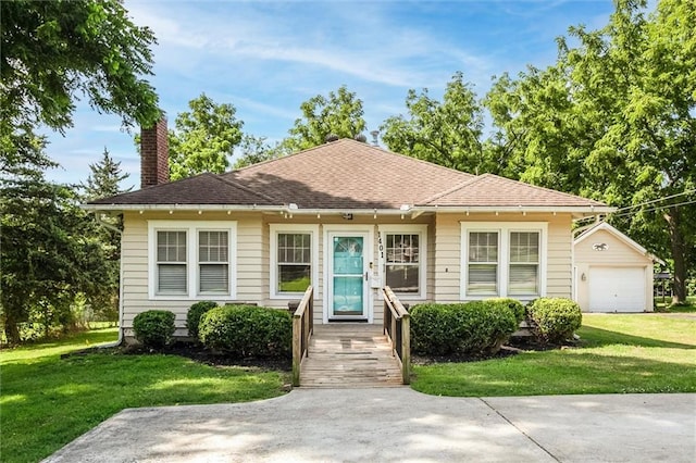 1401 E Mechanic Ave, Independence, MO 64050 - bungalow-style home with a chimney, a front lawn, and a garage