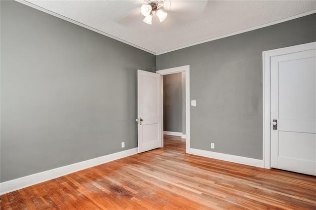 1401 E Mechanic Ave, Independence, MO 64050 - empty room with light wood-type flooring, ceiling fan, and crown molding