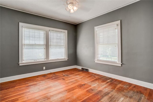 1401 E Mechanic Ave, Independence, MO 64050 - empty room featuring wood-type flooring, ceiling fan, and crown molding