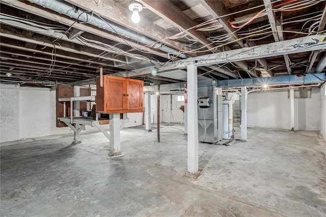 1401 E Mechanic Ave, Independence, MO 64050 - unfinished basement featuring gas water heater