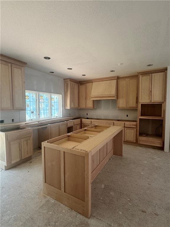2106 W 86th Way, Leawood, KS 66206 - kitchen featuring premium range hood, a textured ceiling, a center island, and recessed lighting