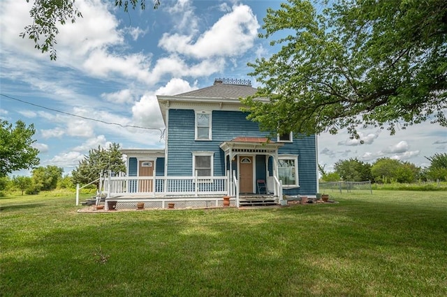 230 N 300th Rd, Overbrook, KS 66524 - italianate house featuring a front yard, a wooden deck, and a chimney
