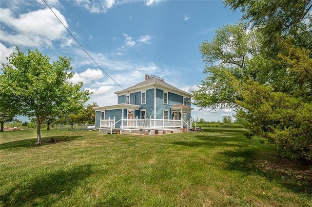 230 N 300th Rd, Overbrook, KS 66524 - rear view of property with a lawn, a wooden deck, and a chimney
