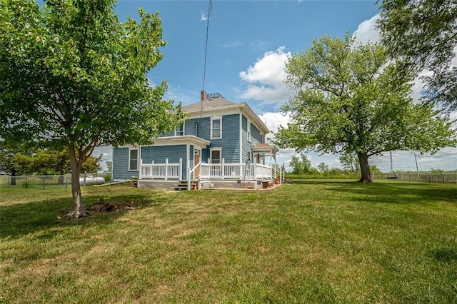 230 N 300th Rd, Overbrook, KS 66524 - back of property featuring a lawn and a wooden deck