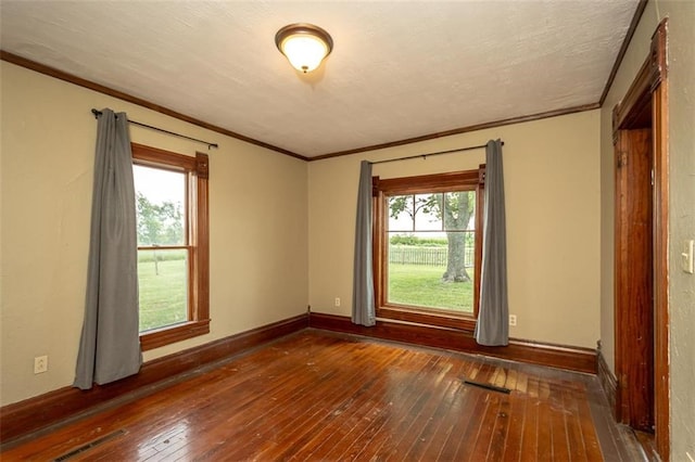 230 N 300th Rd, Overbrook, KS 66524 - spare room featuring hardwood / wood-style flooring and crown molding