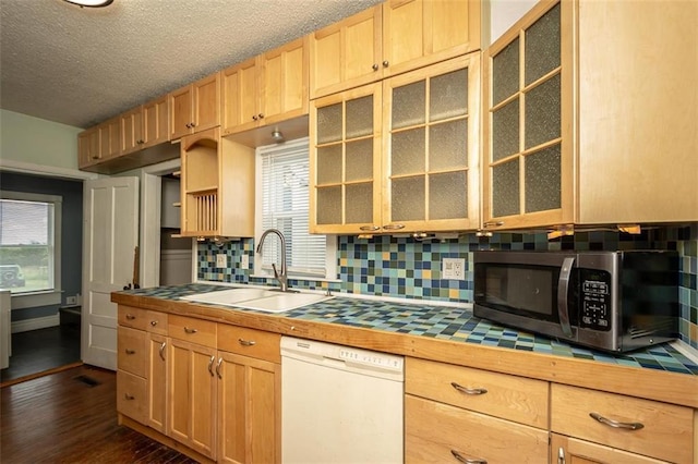 230 N 300th Rd, Overbrook, KS 66524 - kitchen featuring dishwasher, stainless steel microwave, tile counters, decorative backsplash, and a textured ceiling