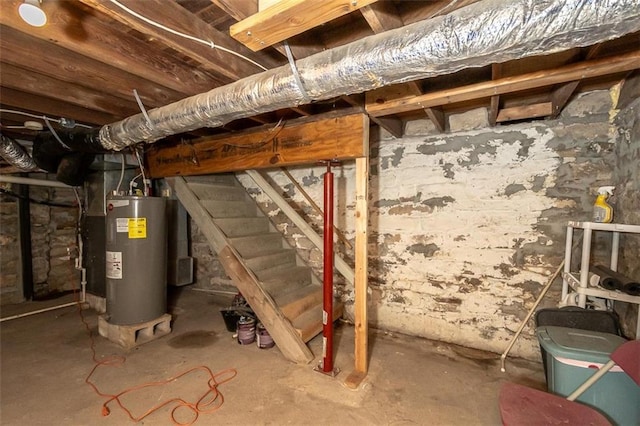 230 N 300th Rd, Overbrook, KS 66524 - unfinished below grade area featuring electric water heater and stairway