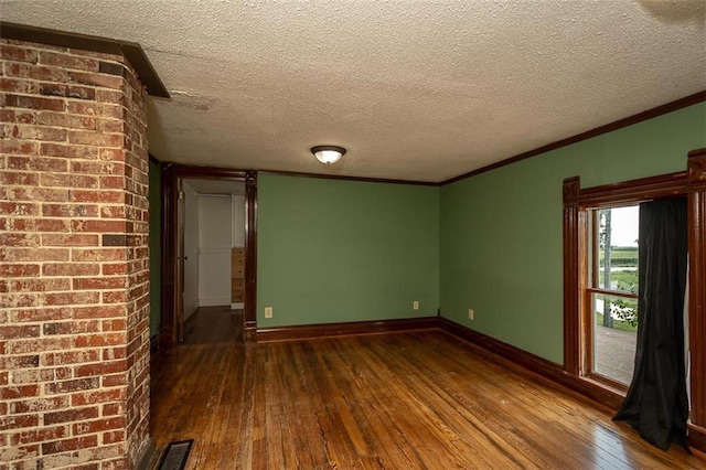 230 N 300th Rd, Overbrook, KS 66524 - empty room with dark wood-style floors, ornamental molding, and a textured ceiling