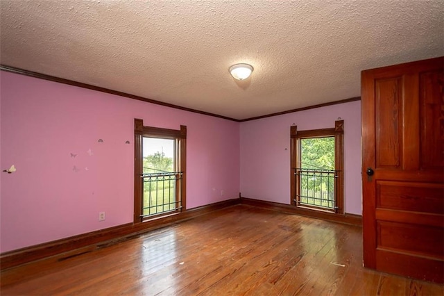 230 N 300th Rd, Overbrook, KS 66524 - spare room with light wood-style flooring, ornamental molding, and a textured ceiling