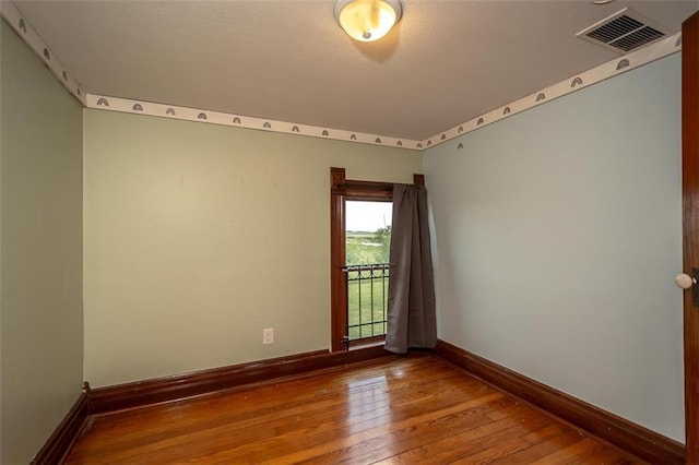 230 N 300th Rd, Overbrook, KS 66524 - unfurnished room with hardwood / wood-style floors and baseboards