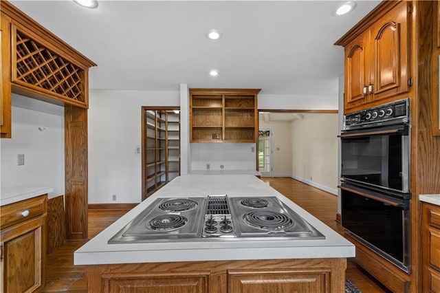 14908 E Pawhuska Rd, Nevada, MO 64772 - kitchen featuring stainless steel electric stovetop, open shelves, a kitchen island, brown cabinets, and recessed lighting