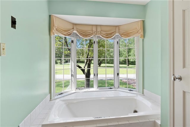 14908 E Pawhuska Rd, Nevada, MO 64772 - full bathroom featuring a whirlpool tub and plenty of natural light
