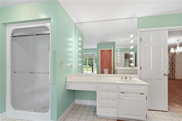 14908 E Pawhuska Rd, Nevada, MO 64772 - bathroom with a shower stall, tile patterned floors, vanity, and a chandelier