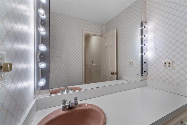 14908 E Pawhuska Rd, Nevada, MO 64772 - bathroom with wallpapered walls and vanity