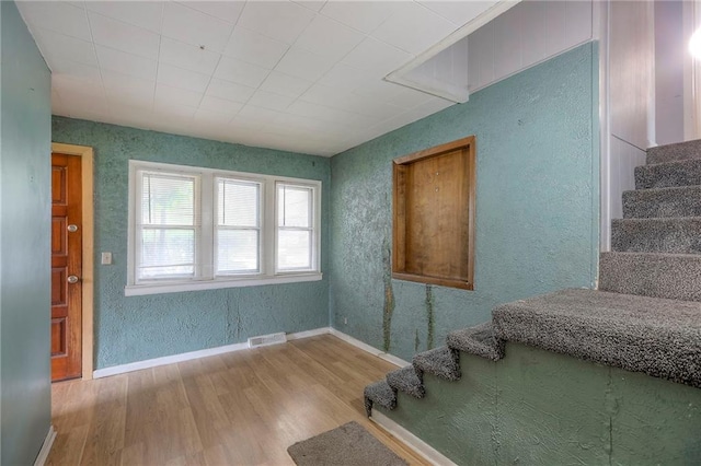8519 Woodland Ave, Kansas City, MO 64131 - stairs with wood finished floors and baseboards
