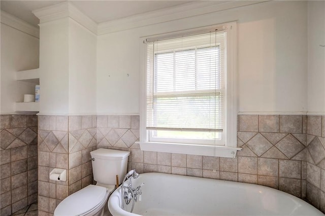 8519 Woodland Ave, Kansas City, MO 64131 - full bathroom featuring a soaking tub, tile walls, a wainscoted wall, and ornamental molding