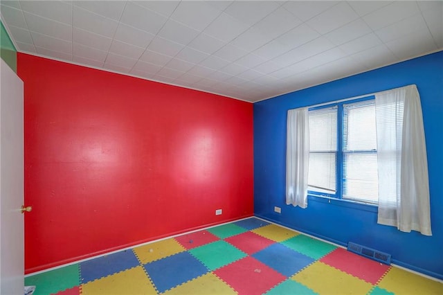 8519 Woodland Ave, Kansas City, MO 64131 - spare room featuring tile patterned floors
